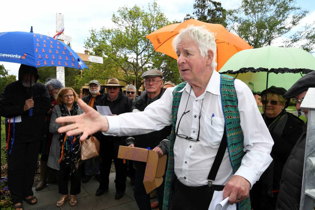 APOLOGY: Former parish priest Michael Parer addresses the group gathered at St Patrick's College's healing garden on Saturday. Picture: Lachlan Bence