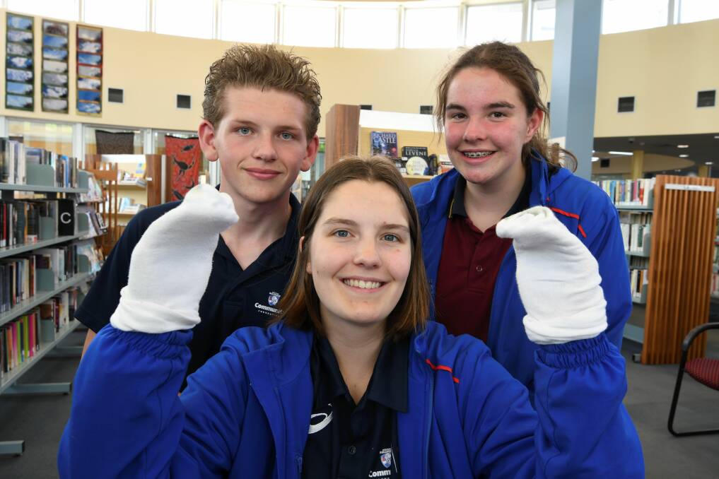 YOUNG LEADERS: Riley Caldow, Hannah Farhall and Amy Zuell are developing a social enterprise called Socks of the West to benefit people in need. Picture: Lachlan Bence