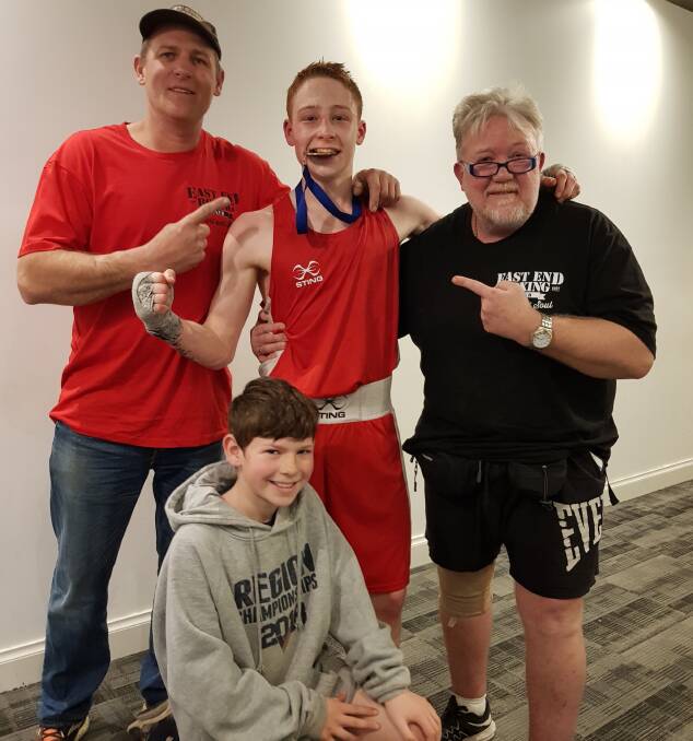 SUCCESS: Coach Brian Butler, Jack Denahy with his state title medal, Brad Lalor and son Xander Lalor (in front). Picture: Kym Denahy-Ryan 