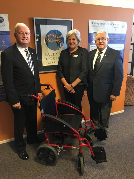 From left to right: Master of Guiding Star Lodge Peter Bond, executive officer Carita Clancy and lodge secretary Brian McDowell with the wheelchair. 
