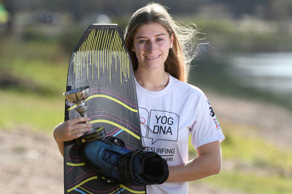 HOPEFUL: Ballarat Clarendon College student Pia Gordon with her board and trophy for qualifying at Lake Burrumbeet. Picture: Lachlan Bence