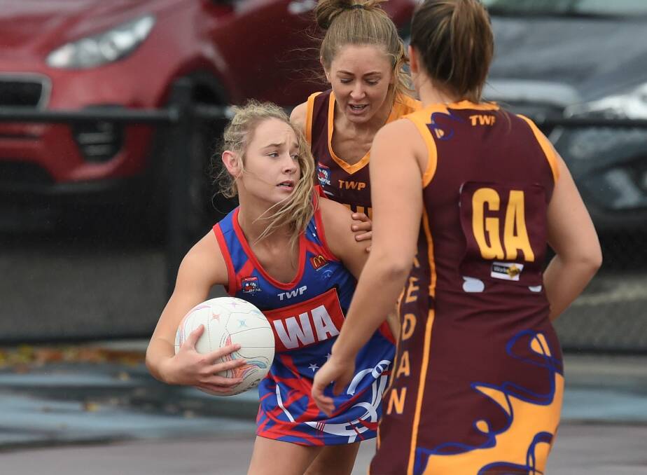 COMEBACK: East Point's Indiannah Burke takes possession of the ball as the Kangaroos fight back against Redan in Saturday's A-grade clash. Picture: Lachlan Bence.