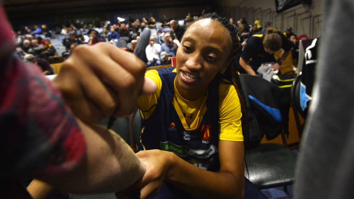 New import Amy Griffin signs autographs after her SEABL debut. Picture: Dylan Burns