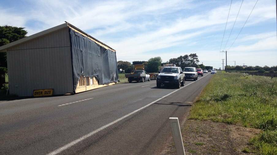 A house fell while being transported near Mugavins Road on the Princes Highway, east of Killarney in south-west Victoria.
