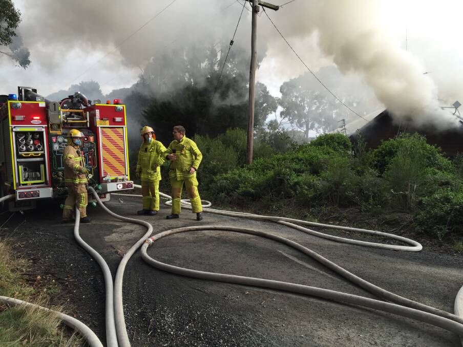 Two people were rescued from the roof of their burning house in Mount Helen on Monday morning. PICTURE: KARA IRVING.