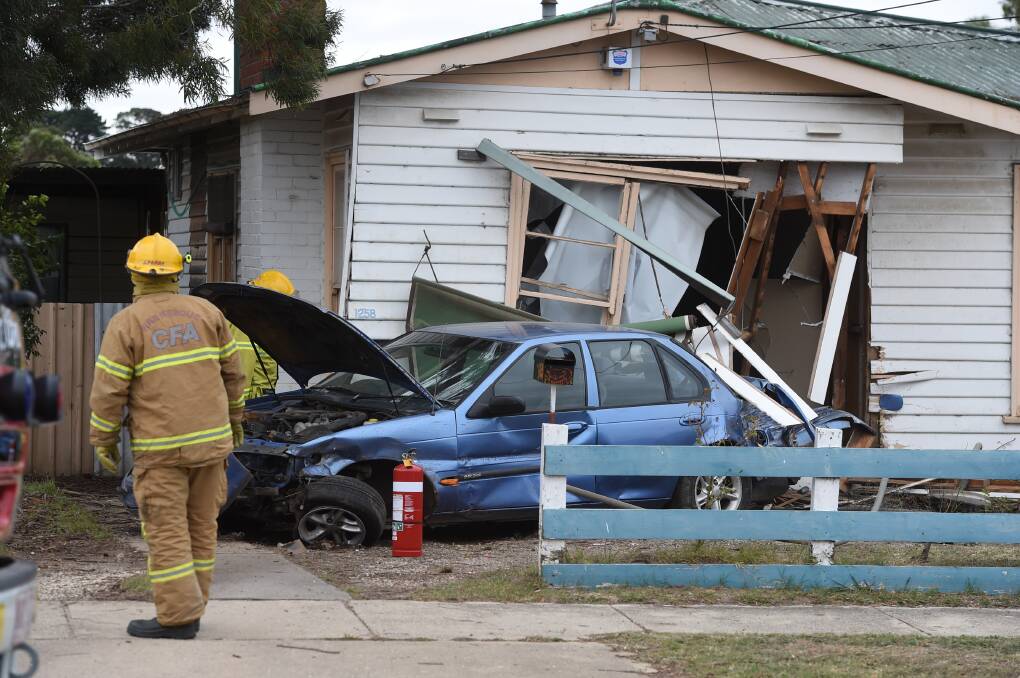 A car has smashed into the front of a Grevillea Road home, causing extensive damage on Tuesday. PICTURE: LACHLAN BENCE