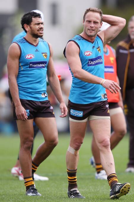 Missing in action: Hawthorn footballer Brad Sewell, right, has been omitted from Saturday’s grand final match against Sydney at the Melbourne Cricket Ground. He has been named as one of three emergencies. PICTURE: GETTY IMAGES