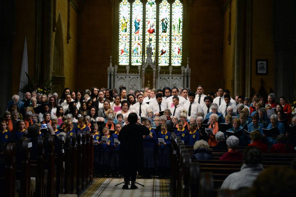 Quite special: The choirs come togethr to sing Amaing Grace. PICTURE: KATE HEALY