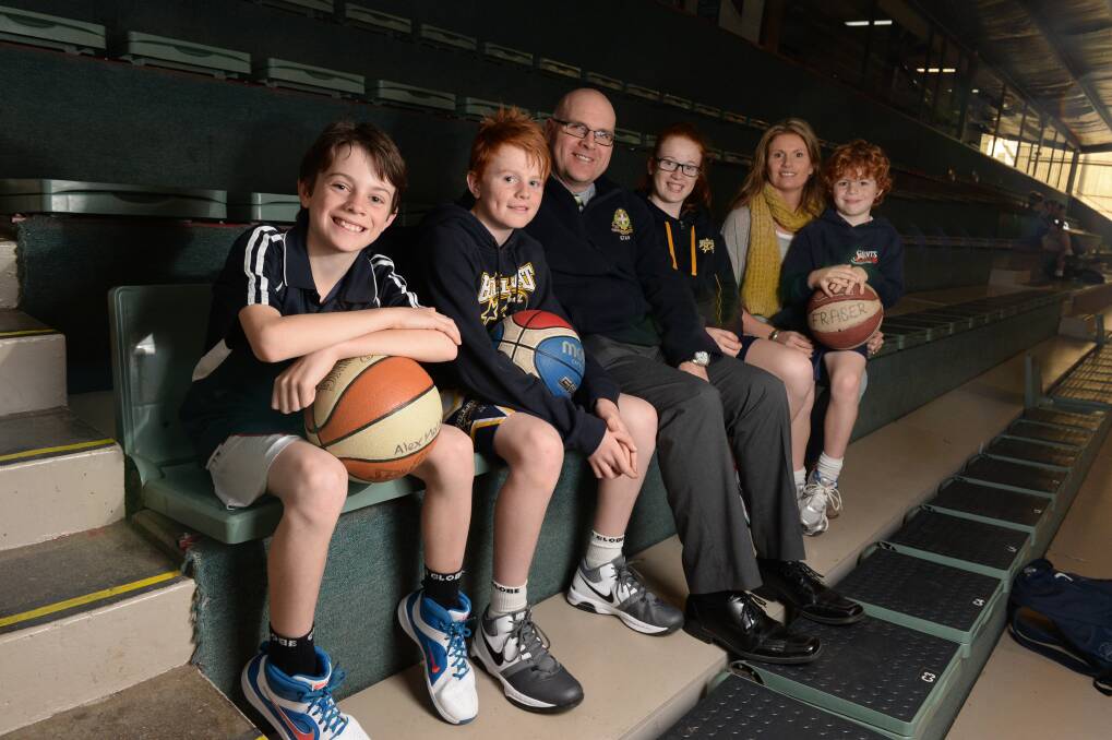 Basketball enthusiasts:  The Molan family, from left, Alex, 9, Charlie, 11, Tom, Sophie, 13, Andrea, and Fraser, 7, are kept busy with the sport. PICTURE: KATE HEALY       
