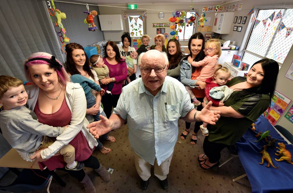 Supporter: Father Bob Maguire meets with mums and their children during a visit to the Link-Up Young Parents program in Delacombe yesterday. 
PICTURE: JEREMY BANNISTER