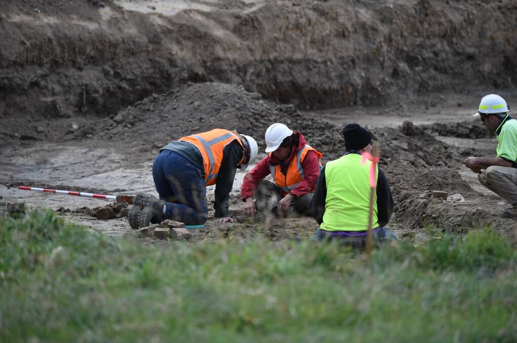Nothing yet: Workers continue digging at the former Ballarat orphanage site on Thursday. PICTURE: LACHLAN BENCE