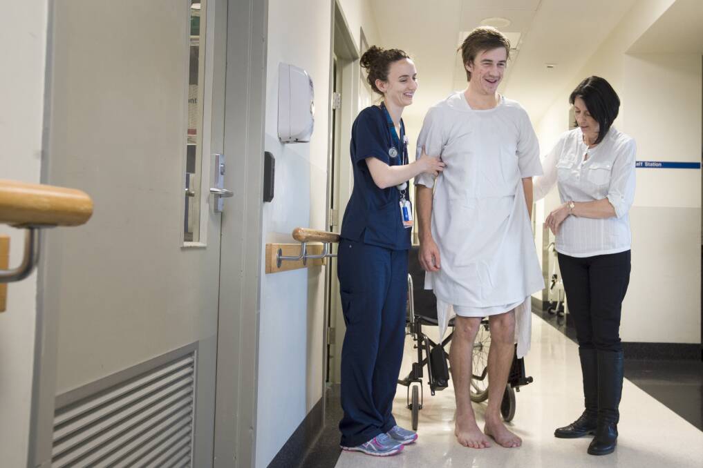 Cameron Dunne at the Royal Melbourne Hospital with trauma nurse Bridget and mum Sharyn. PICTURE: SHAWN SMITS
