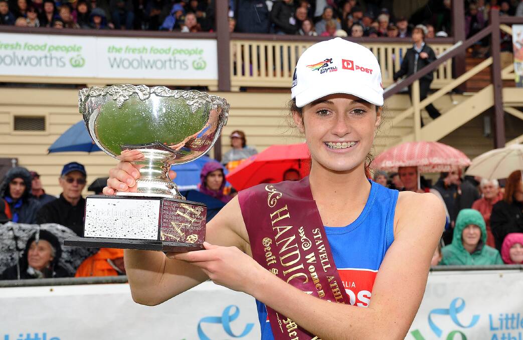 TRIUMPH: Grace O’Dwyer with the trophy following her victory in the Stawell Women’s Gift. PICTURE: Kerri Kingston