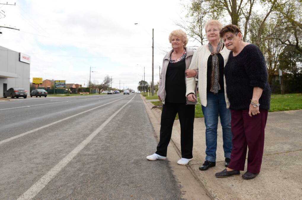 Dangerous crossing: Shirley Pattinson, Sue Thurgood and Dot Stowe at Latrobe Street. PICTURE: KATE HEALY
