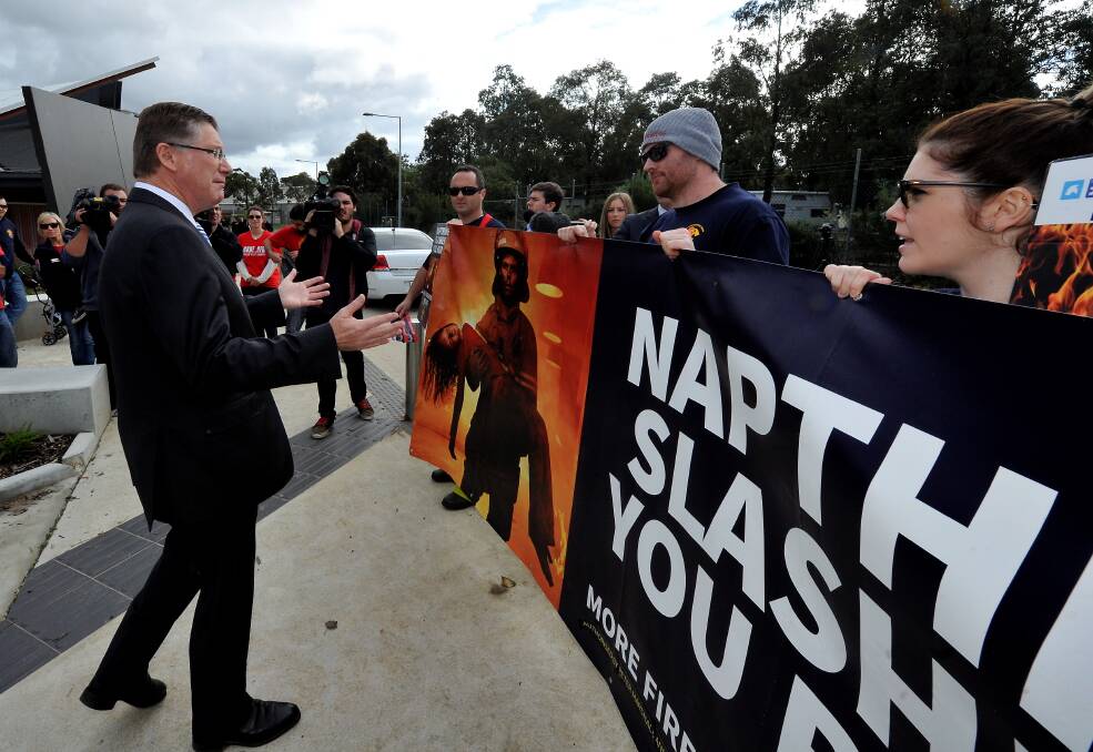 POPULAR OR NOT: Premier Denis Napthine is met by protesters during a visit to Ballarat in June.