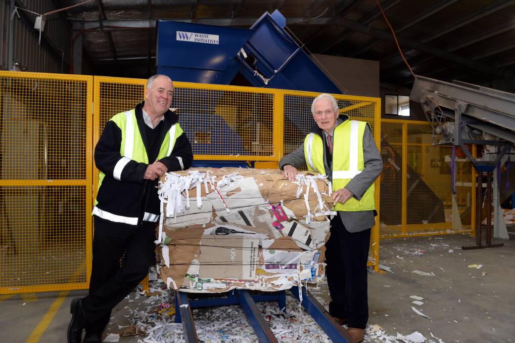 Compact: BRI chief executive officer Cliff Barclay and Percy Baxter Trust adviser Cameron McNaughton with the new bailer. PICTURE: KATE HEALY