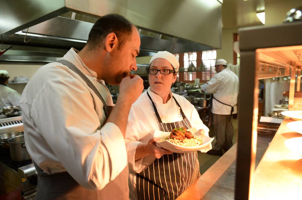 Test: Chef Riccardo Momesso tastes non-apprentice second-year student Donna Fear’s dish. PICTURE: ADAM TRAFFORD