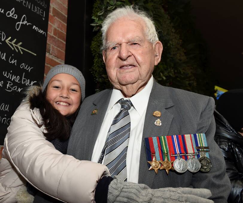 Supportive: Ballarat serviceman Donald McNeight with Morgan Holmes, 9. PICTURE: LACHLAN BENCE
