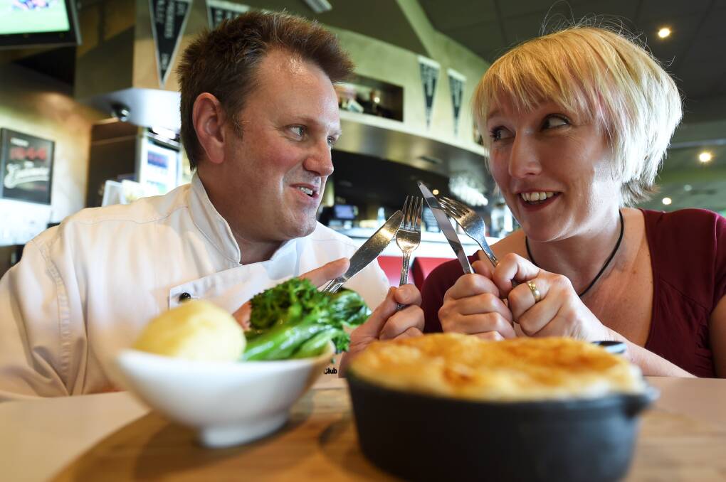 Gourmet: North Ballarat Sports Club head chef Simon Beaton and Cina Stevens dig into a pie. PICTURE: LACHLAN BENCE