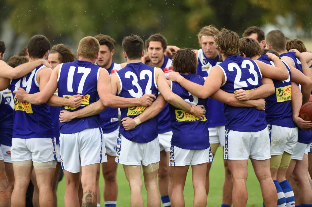 Team spirit: Sunbury players in a huddle. PICTURE: LACHLAN BENCE