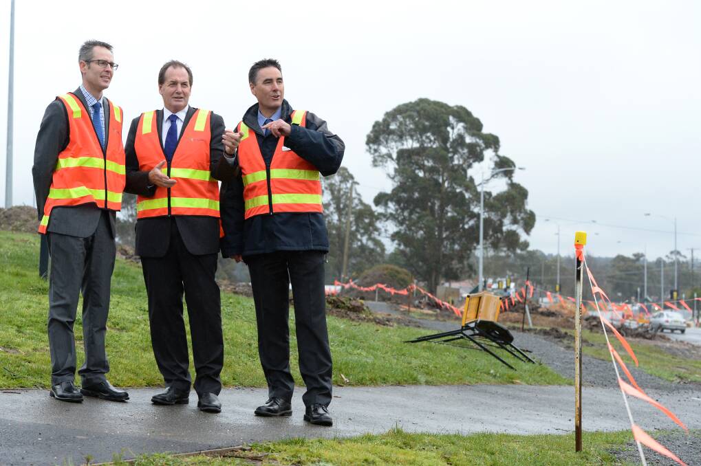 Discussion: Liberal Candidate for Buninyong Ben Taylor, Simon Ramsay MP and Vicroads regional director Western Victoria Ewen Nevett survey the project at Geelong Road. PICTURES: KATE HEALY