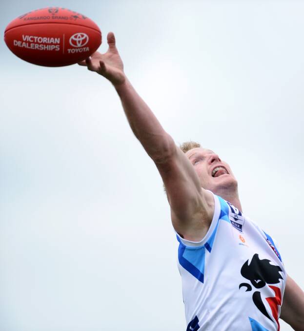 Reach: North Ballarat ‘s Nick Peters is at full stretch to reach this against Sandingham in Ballarat on Saturday. PICTURE: Adam Trafford
