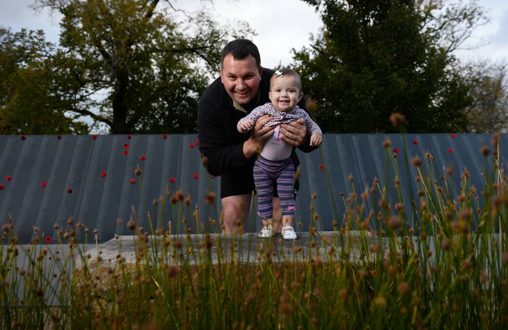 special time: Veteran serviceman Simon Staton with his now healthy daughter Leah. PICTURE: ADAM TRAFFORD