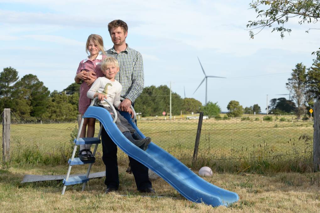 Accepting: Abigail, 6, Huon, 4, and Stephen Kent are used to playing and living near wind turbines.
PICTURE: KATE HEALY