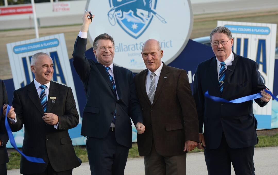 Blue ribbon day: Premier Denis Napthine and Cr John Burt at the Ballarat & District Trotting Club for the opening of the track in 2013. At left is club president Greg Moy, at right is club treasurer Dennis Foley. PICTURE: ADAM TRAFFORD