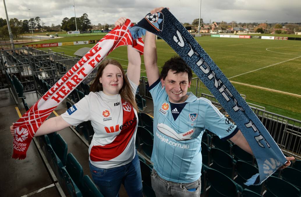 FANS: Channy Donnelly and Danny Avery will support opposing teams in Tuesday night’s FFA Cup clash. PICTURE: ADAM TRAFFORD