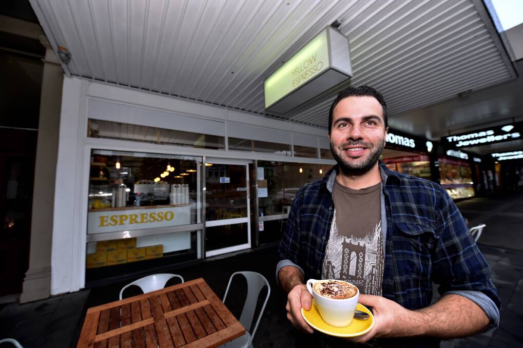 New look: Co-owner Leo Trigazis takes time to enjoy a coffee at his cafe. PICTURE: JEREMY BANNISTER