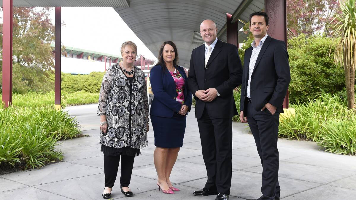 Assistance: Australian Industry Group regional manager Kay Macaulay, FMP Group Australia P/L’s Susan Honeyman, minister for manufacturing David Hodgetts and Haymes General Manager Rodney Walton. PICTURE: JUSTIN WHITELOCK
