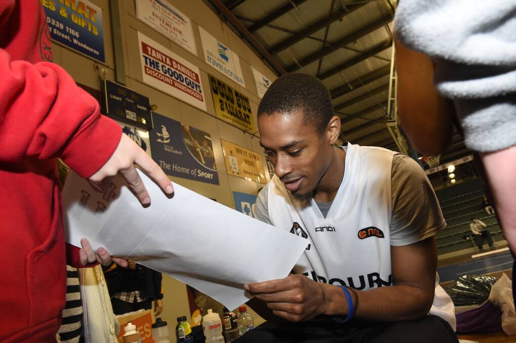 Fan favourite: Stephen Dennis signs merchandise at the Minerdome on Monday. PICTURE: JUSTIN WHITELOCK