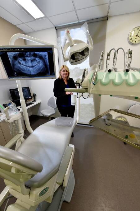 ‘‘A good thing for Ballarat’’: Ballarat Health Services dental manager Jacqui Nolan inspects one of the state-of-the-art dental chairs at the new Phoenix College clinic. PICTURE: JEREMY BANNISTER
