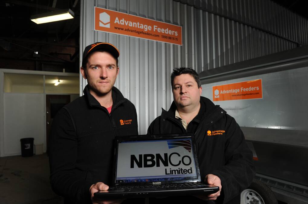 Out of touch: Advantage Feeders managering director Gerard Roney and general manager Paul Pritchett are frustrated after being left with no landline or connection to the NBN. PICTURE: JUSTIN WHITELOCK
