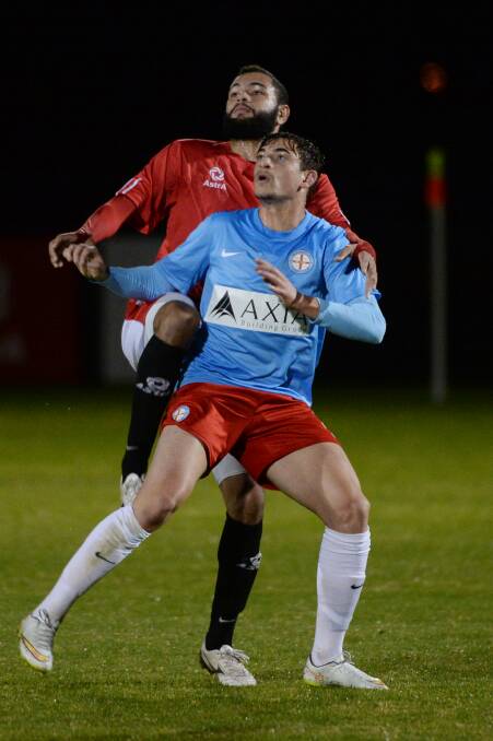 Contest: Ballarat’s David King tussles with Melbourne City’s Marc Marino. PICTURE: KATE HEALY