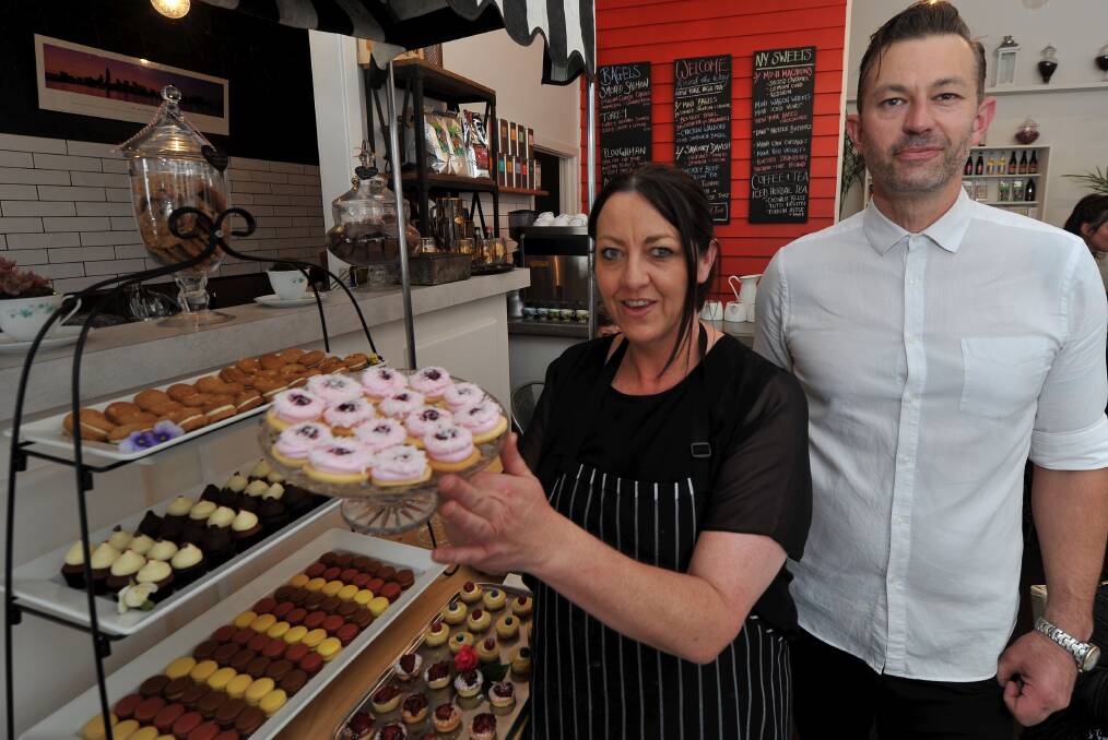 Tasty morsels: Danielle Cartledge and Peter Marios held high tea at the Round the Way New York Bakeshop on Main Road. PICTURE: LACHLAN BENCE