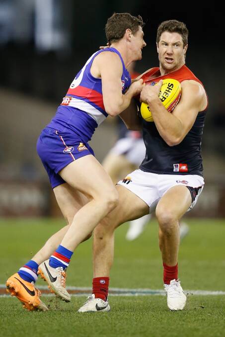 James Frawley of the Demons evades a tackle during the round 15 AFL match between the Western Bulldogs and the Melbourne Demons at Etihad Stadium last month. PICTURE: GETTY IMAGES