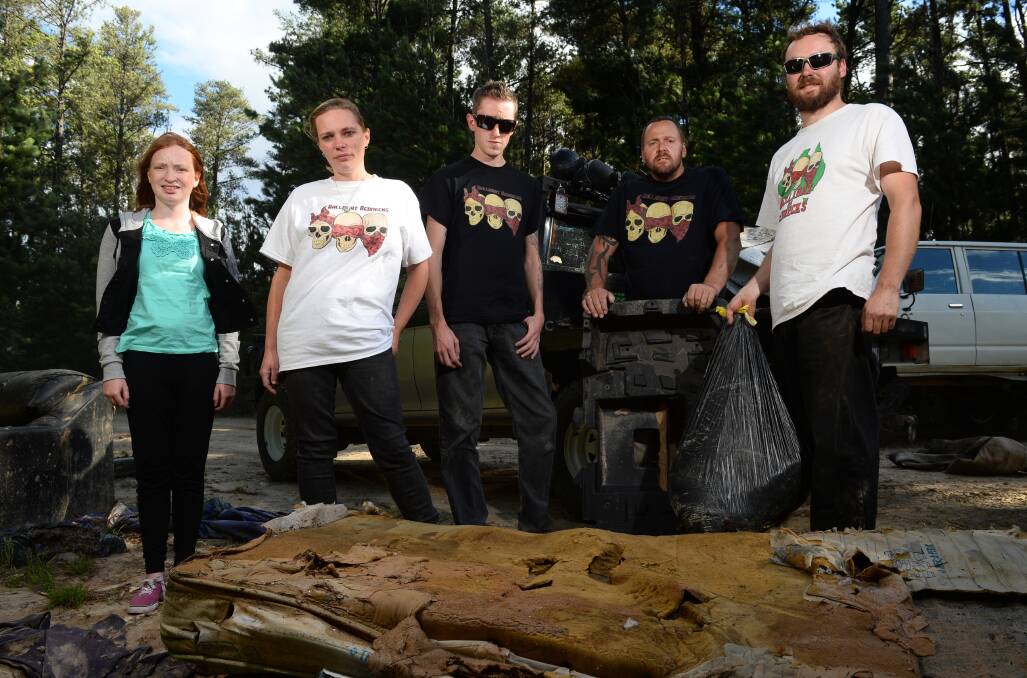 Ballarat Rednecks 4x4 have been cleaning up rubbish they find on drives.Some of the members are, from left, Amber Bumpstead, Belinda Smith, James Baum, Troy Byers and Nathaniel Smith.