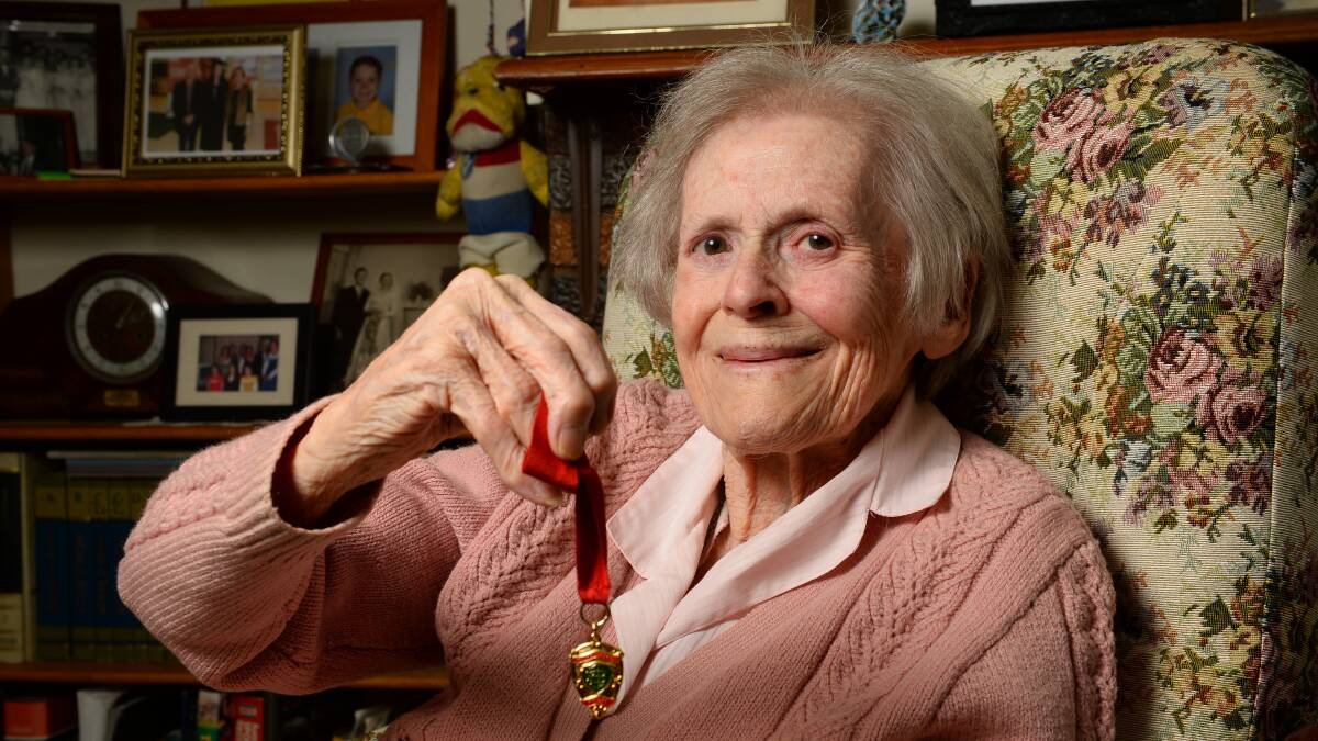 Jean Wallis, 87, with her late husband's 1952 Henderson Medal.