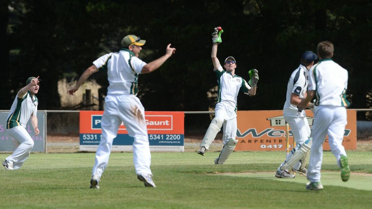 Keeper Jake Pring celebrating with team mates after catching Joel Mathews out. PIC: KATE HEALY