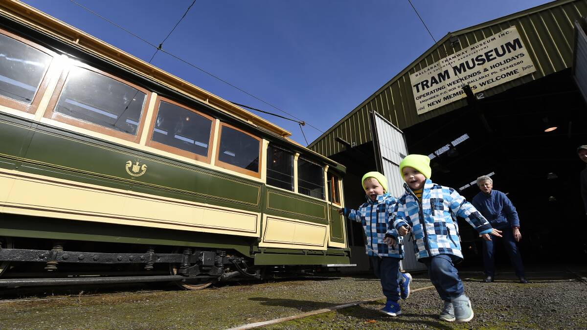 Twins Sam and Jack Carrucan race for a ride on a Ballarat tram as part of the National Trust Heritage Festival. Picture: JUSTIN WHITELOCK