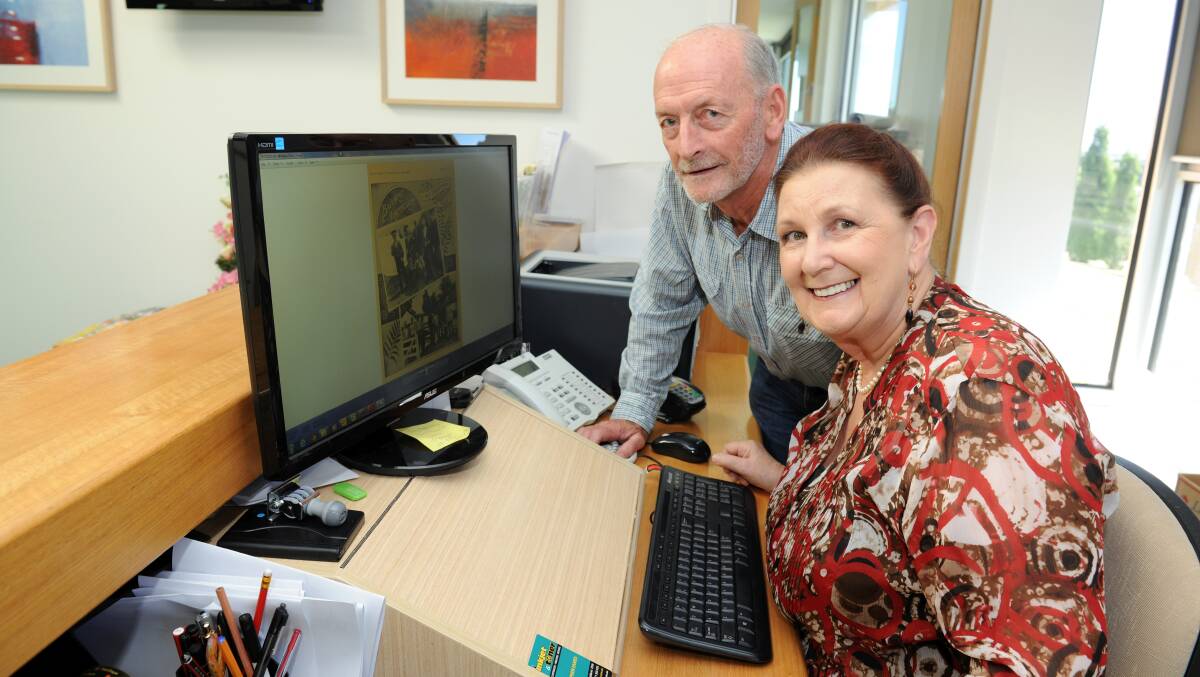 Garry Snowden and Dot Wickham hard at work on a book about Ballarat's WWI servicemen and women buried in our two cemeteries. Picture: LACHLAN BENCE