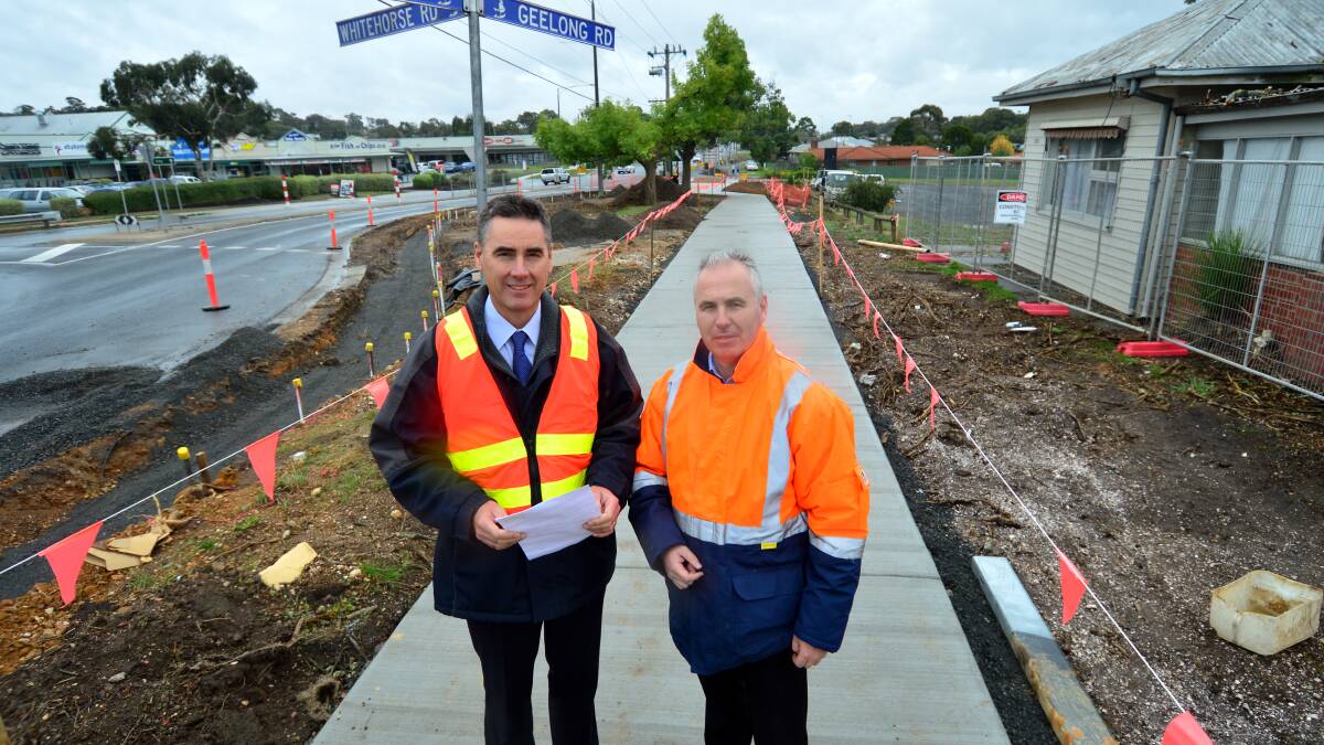 UNDER WAY: VicRoads regional director Ewen Nevett and  operations manager Brad Pryor inspecting the works. 
PICTURE: DYLAN BURNS