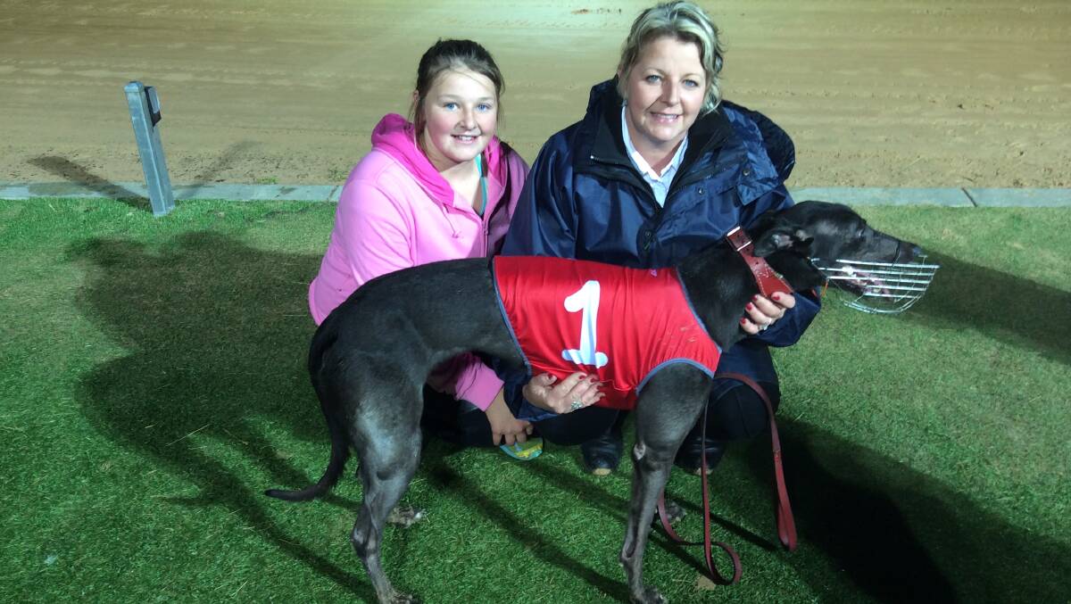 Lovely Banks trainer Kelly Bravo and her daughter Bronte with Ballarat Greyhound Cup heat winner Secret Spell at Morshead Park on Wednesday night.