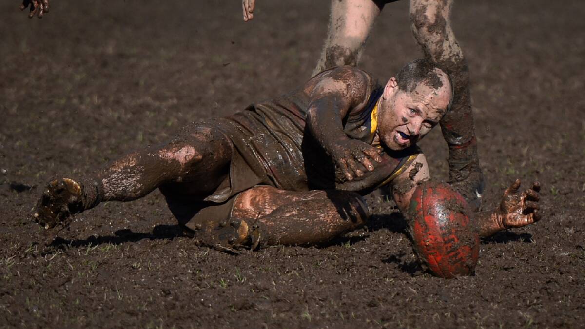 Beaufort's Daniel O'Kelly struggles in the mud in what turned out to be Creswick's last home game of the season at the Doug Lindsay Reserve. 
