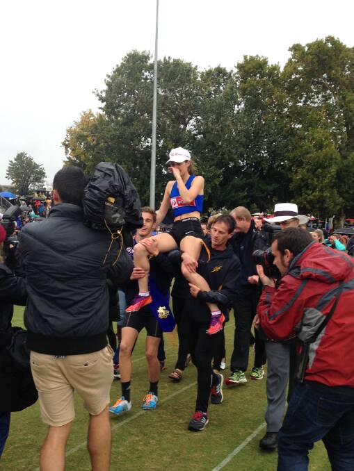 Grace O'Dwyer is carried to the victory dais after her Stawell Women's Gift triumph.
