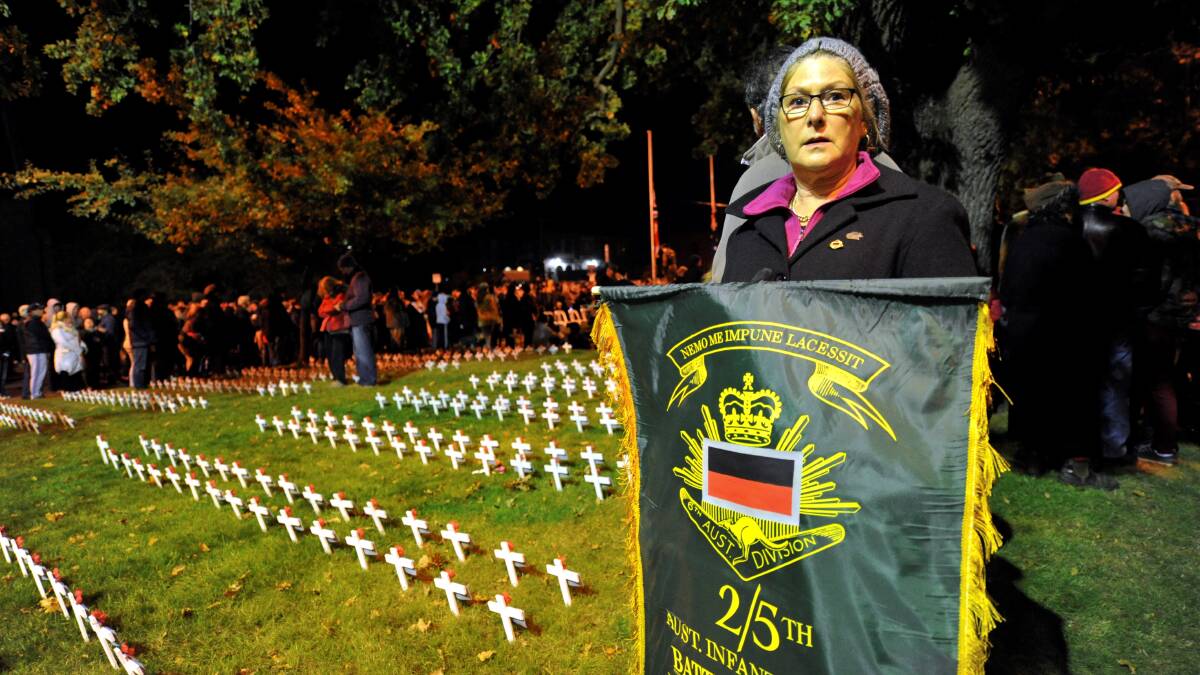 Kay Sandman with her father's Battalion banner. PICTURE: JEREMY BANNISTER