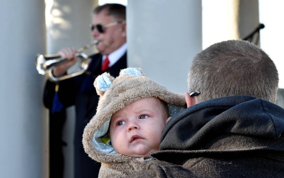 Hayden Masterson listens to Bugler Alf Clements. PICTURE: JEREMY BANNISTER