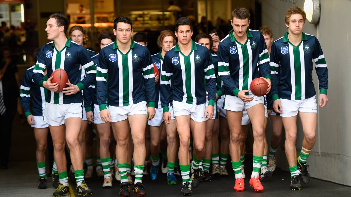 The St Pats boys run out onto the MCG. PICTURE: ADAM TRAFFORD
